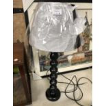 A MODERN BLACK LAMP BASE WITH SHADE