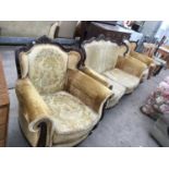 A VINTAGE CARVED MAHOGANY TWO SEATER SOFA AND TWO MATCHING ARM CHAIRS