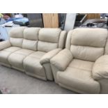 A CREAM LEATHER THREE SEATER SOFA AND ARMCHAIR