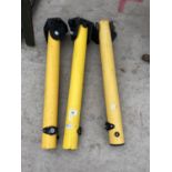 THREE YELLOW BOLLARDS