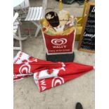 AN ICE CREAM BOARD AND TWO PARASOLS