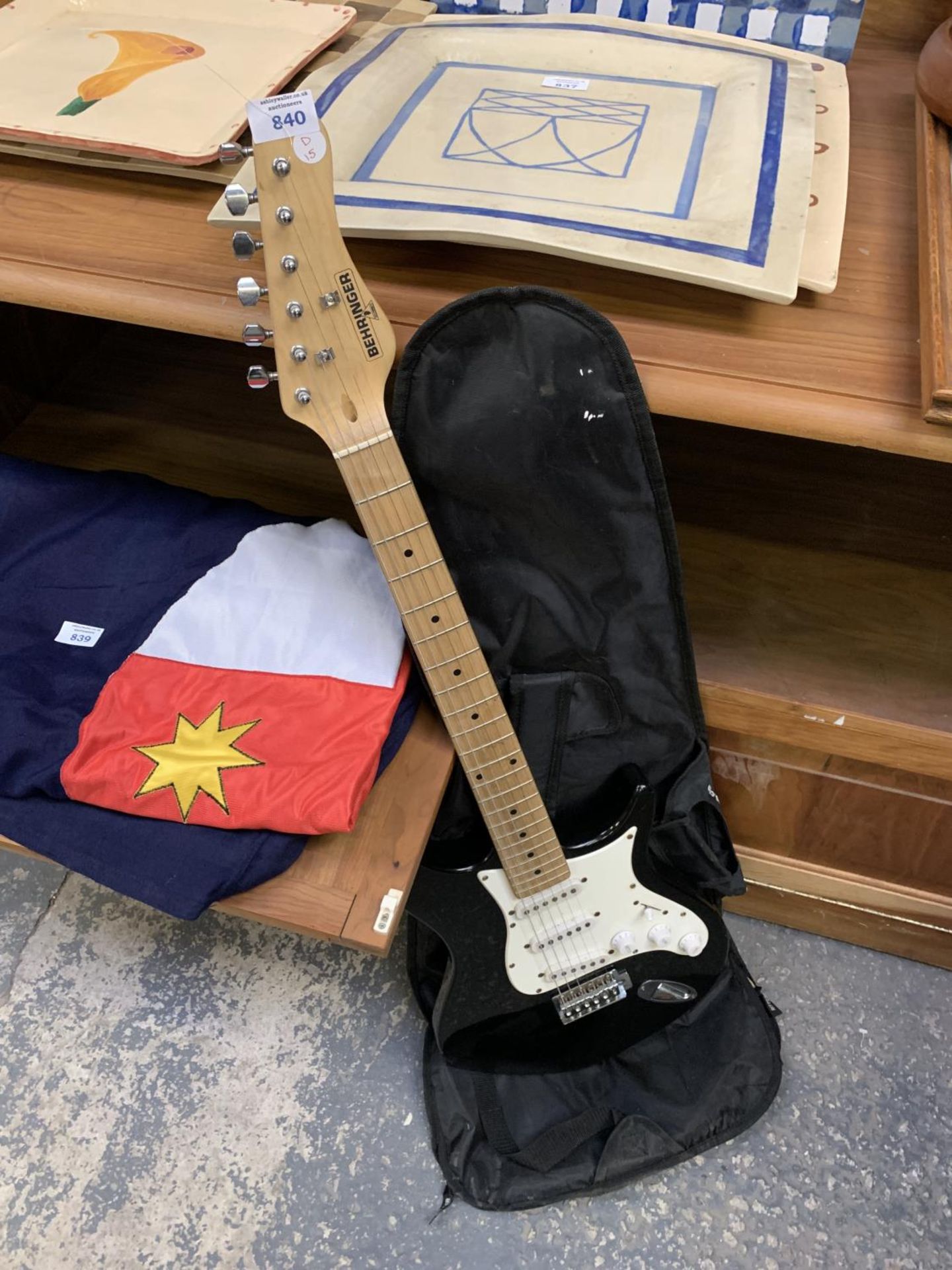 A BEHRINGER STRAT STYLE ELECTRIC GUITAR AND CASE