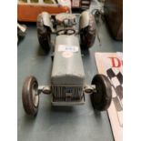 A TIN METAL TRACTOR MODEL