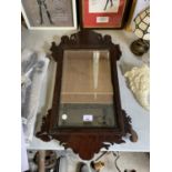 A DECORATIVE MAHOGANY MIRROR