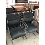 TWO BLACK LEATHERETTE CHAIRS ON CHROME SUPPORTS