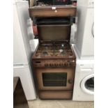 A FOUR RING GAS HOB AND OVEN IN WORKING ORDER