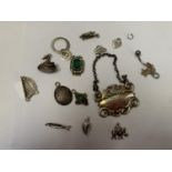 A COLLECTION OF SILVER ITEMS TO INCLUDE CHARMS ETC