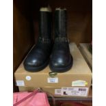 A PAIR OF BLACK UGG BOOTS WITH BOX