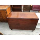 A MAHOGANY DROP LEAF DINING TABLE