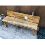 A SMALL WOODEN GARDEN BENCH