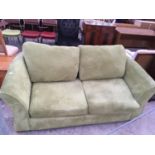 A LIME GREEN TWO SEATER SOFA