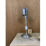 A CHROME MICROPHONE ORNAMENT