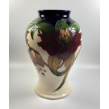 A MOORCROFT POTTERY 'ANNA LILY' PATTERN VASE, HEIGHT 23.5CM