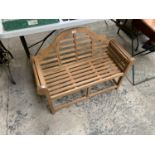 A WOODEN CHILDREN'S GARDEN SEAT / BENCH