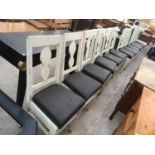 TWELVE WHITE FRAMED CHAIRS WITH BLACK SEATS