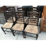 SIX OAK LADDER BACK DINING CHAIRS WITH RUSH SEATS