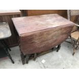 AN OAK DROP LEAF DINING TABLE ON BARLEY TWIST SUPPORTS (REQUIRES REPAIR TO LEAF SUPPORT)