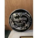 A BLACK AND CHROME FORD MOTOR CO SIGN