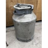 A VINTAGE METAL MILK CHURN