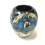 A SMALL MOORCROFT RED ROSE BLUE VASE