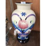 A LARGE TUPTON WARE FLORAL PATTERN BALUSTER FORM VASE