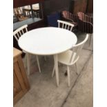 A CIRCULAR WHITE KITCHEN TABLE AND THREE CHAIRS