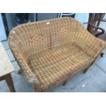 A WICKER TWO SEATER SOFA