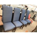 FOUR HIGH BACK UPHOLSTERED DINING CHAIRS ON ORNATE MAHOGANY SUPPORTS