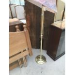 A MAHOGANY CABINET WITH SINGLE DOOR AND TWO SLIDING DOORS AND A BRASS STANDARD LAMP