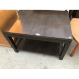 A MODERN COFFEE TABLE WITH LOWER SHELF