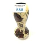 A SMALL CHOCOLATE COSMOS MOORCROFT VASE