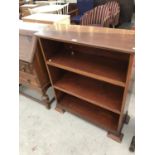 A MAHOGANY THREE SHELF BOOKCASE