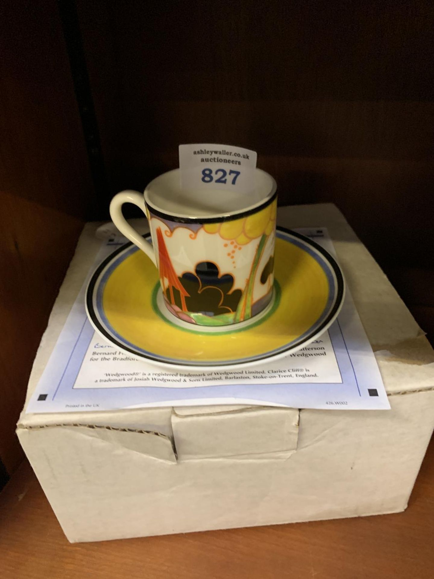 A LIMITED EDITION 'SUMMERHOUSE' CLARICE CLIFF CUP AND SAUCER WITH CERTIFICATE AND BOX