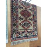 AN ORANGE AND BLUE PATTERNED RUG