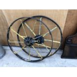 A PAIR OF VINTAGE CAST METAL WHEELS