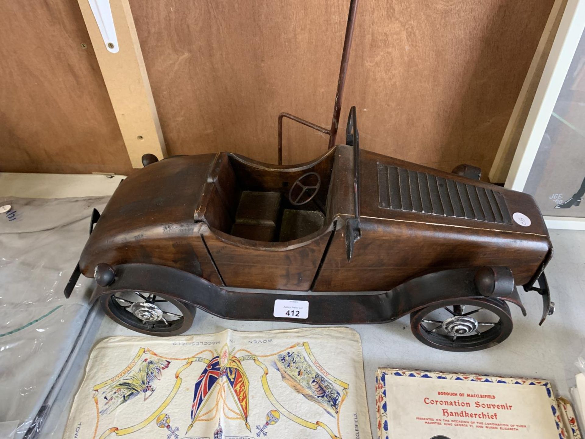 A VINTAGE WOODEN AND METAL CAR MODEL