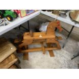 A MODERN WOODEN ROCKING HORSE MODEL