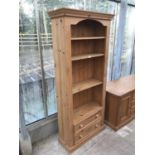 A PINE FOUR TIER BOOKCASE WITH TWO LOWER DRAWERS