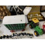 A TOY MODEL TRACTOR TOGETHER WITH TRAILER