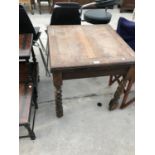 A OAK FARMHOUSE STYLE DINING TABLE WITH BARLEY TWIST LEGS