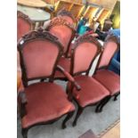 SIX MAHOGANY RED UPHOLSTERED CHAIRS TO INCLUDE FOUR CHAIRS AND TWO CARVERS