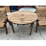 A CIRCULAR TOPPED WOODEN GARDEN TABLE