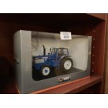 A UNIVERSAL HOBBIES FORD TW25 FORGE II 1-32 SCALE , ITEM NO UH4028 MODEL BOXED AND IN MINT CONDITION