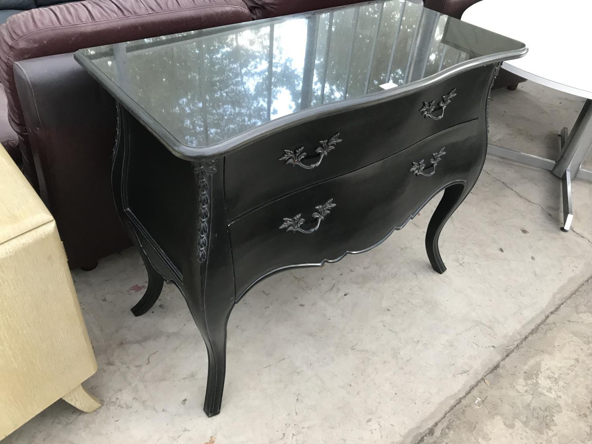 A BLACK ORNATE CHEST OF DRAWERS WITH TWO LONG DRAWERS