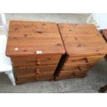 A PAIR OF PINE BEDSIDE CABINETS WITH THREE DRAWERS