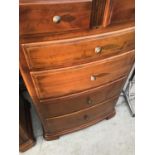 A CHERRY WOOD BOW FRONT CHEST OF TWO SHORT AND FOUR LONG DRAWERS