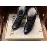 A PAIR OF BLACK DIESEL BOOTS IN A SIZE 5 TOGETHER WITH BOX