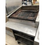 A BAKERS PRIDE GAS GRIDDLE ON WHEELS WITH TWO LOWER SHELVES