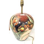 A LARGE MOORCROFT POTTERY TULIP PATTERN LAMP BASE, HEIGHT INCLUDING FITTING 42CM