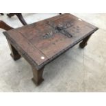 A CARVED OAK COFFEE TABLE
